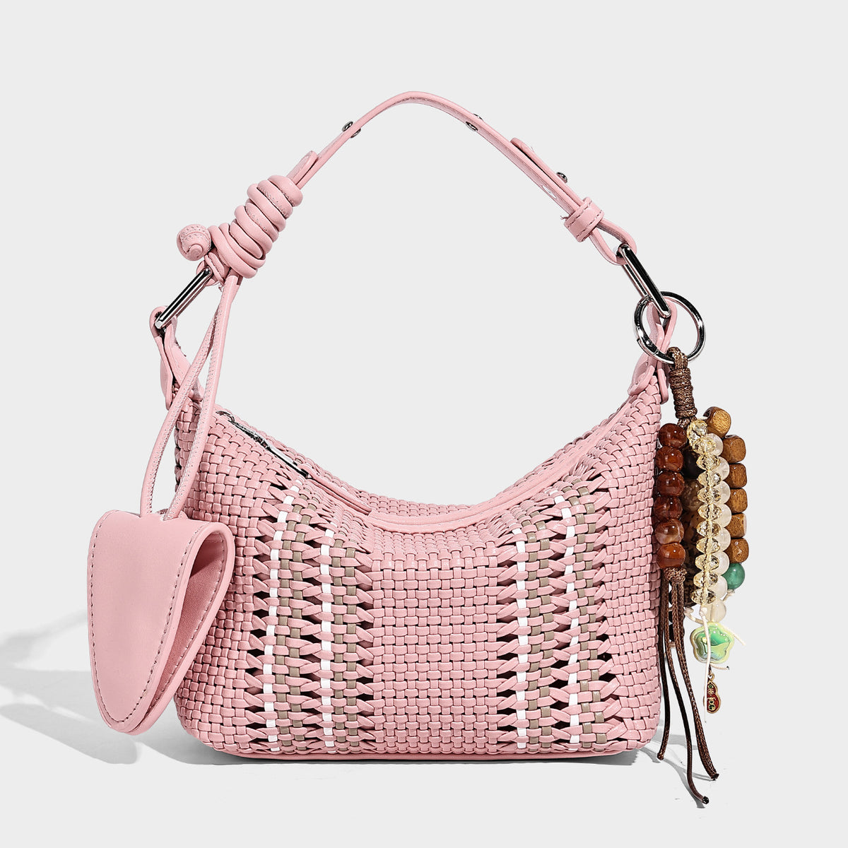 Small woven crescent shoulder bag with leather-look trim, zip closure, silver-tone ring hardware, and beaded tassel charm