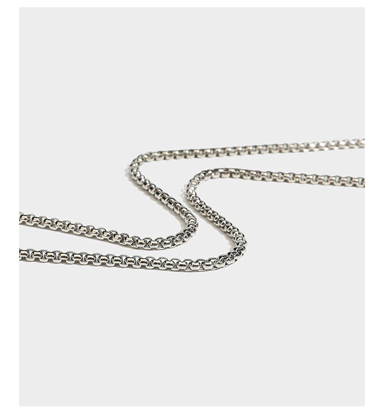 Structured rectangular hard-case clutch bag covered in all-over rhinestone crystal embellishment with curved kiss-lock top