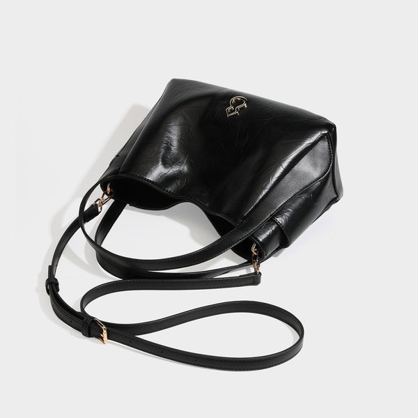 Black glossy crinkled leather-look convertible shoulder tote bag with gold gourd-shaped emblem hardware and detachable