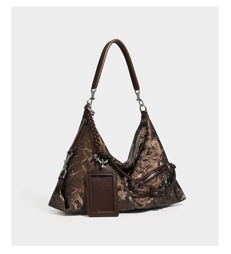 Slouchy hobo shoulder bag in crinkled metallic brown leather-look finish with braided rope knots, silver-tone hardware