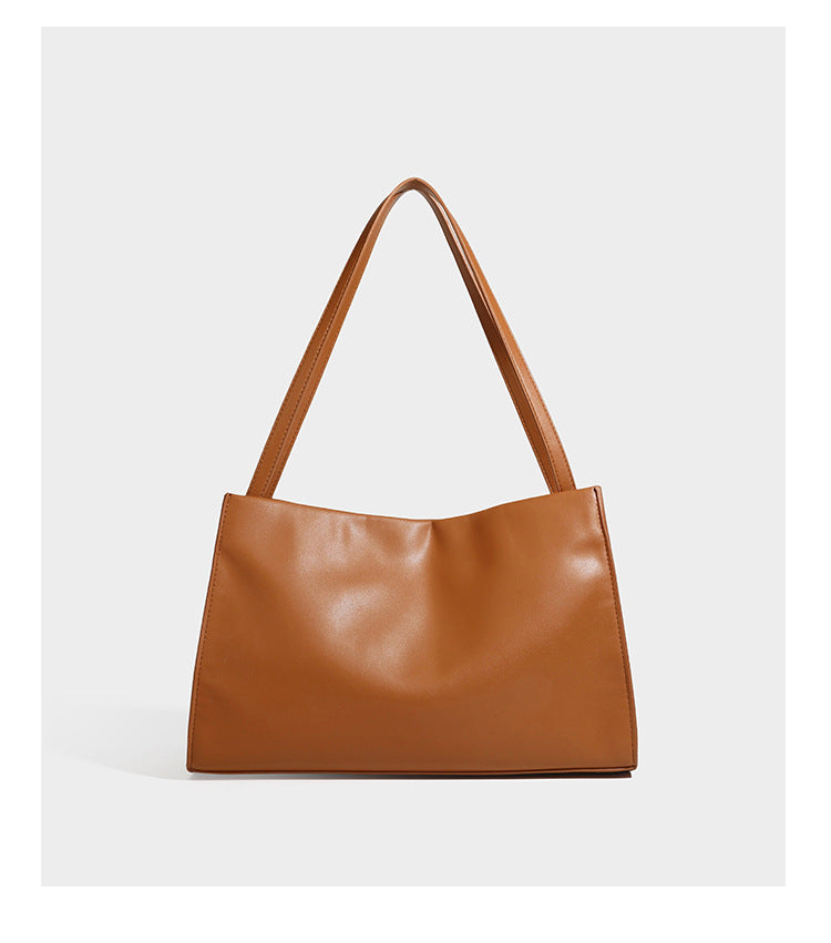 Structured rectangular shoulder tote bag with smooth leather-look finish, long double straps, and gold-tone gourd emblem on