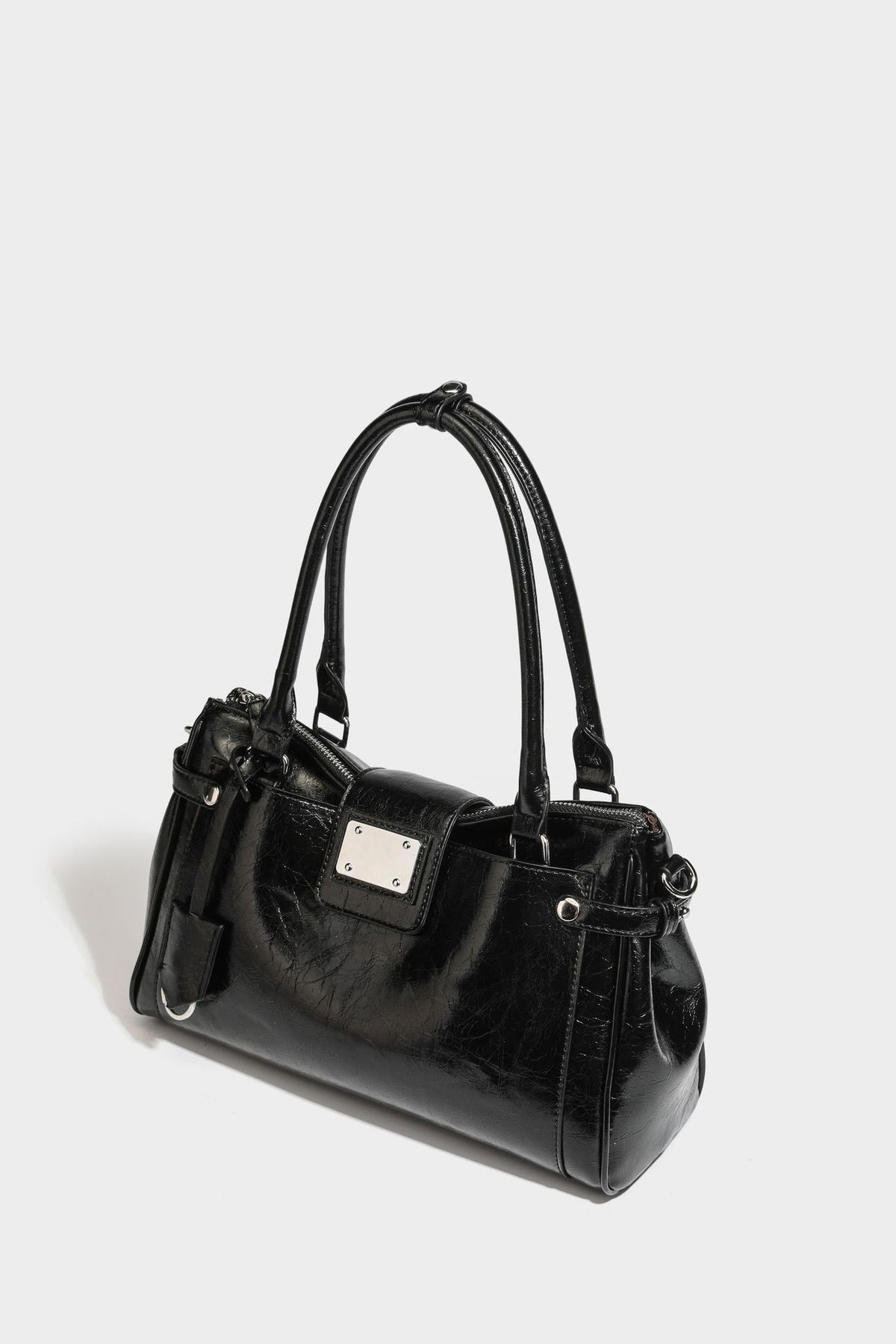 Structured glossy crinkled leather-look satchel with double top handles, front metal-plaque tab, silver-tone hardware, and