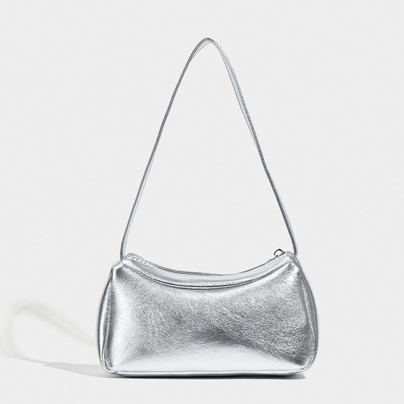 Compact curved silver metallic shoulder bag with top zip closure and slim single strap, detail view 6