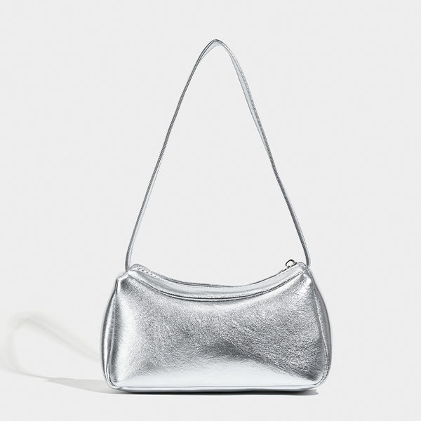 Compact curved silver metallic shoulder bag with top zip closure and slim single strap, detail view 6
