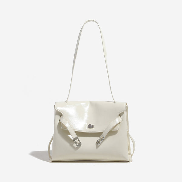 Structured rectangular flap shoulder bag in glossy leather-look finish with silver-tone turn-lock closure and adjustable
