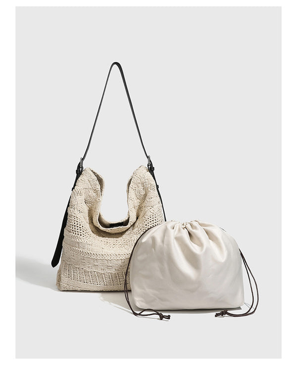 Cream woven rope-cord hobo bag with black adjustable leather-look strap and matching cream drawstring pouch, detail view 7