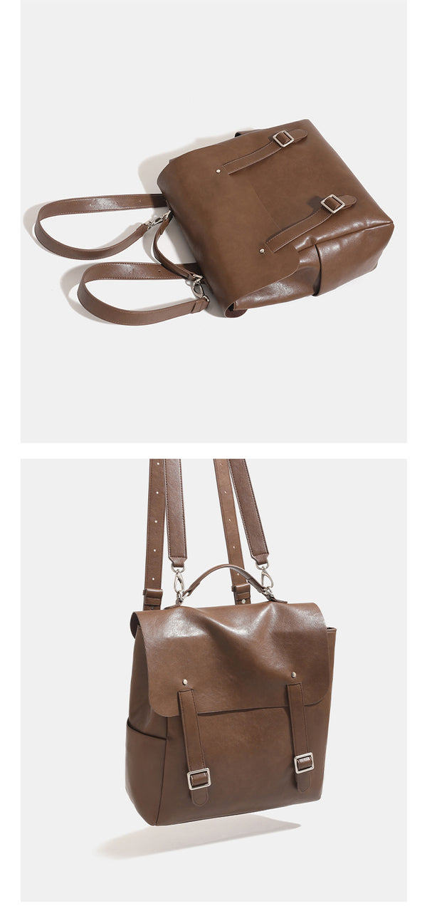 Structured flap backpack handbag in smooth leather-look finish with buckle front pocket, top handle, and silver-tone