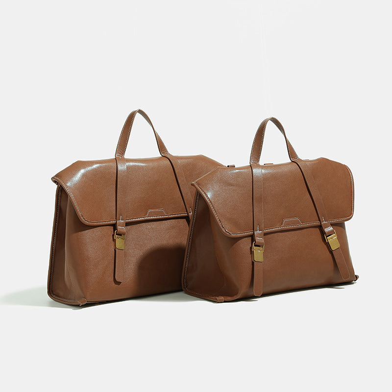 Strukturierter wandelbarer Rucksack in Denim-Optik mit Besätzen in Cognac-Lederoptik, Schnallenbeschlägen in Goldoptik und Tragegriff oben