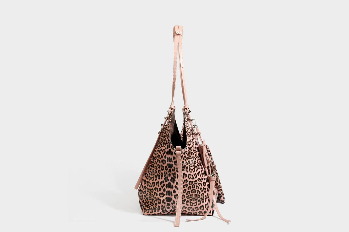 Large leopard print shoulder tote bag with glossy finish, long double straps, front zip pocket, silver-tone hardware, and