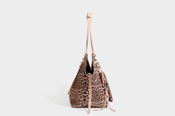 Large leopard print shoulder tote bag with glossy finish, long double straps, front zip pocket, silver-tone hardware, and