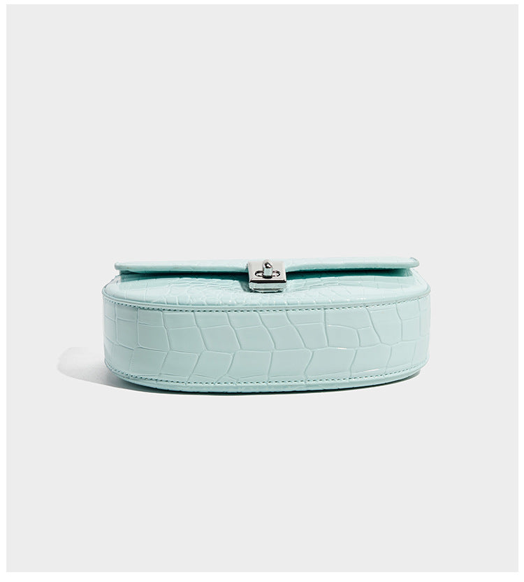Glossy croc-embossed mini saddle bag with silver-tone turn-lock clasp and short top handle, detail view 11