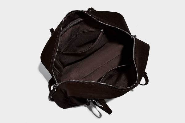 Structured rectangular matte suede-like shoulder bag with silver-tone hardware, zip closure, double top handles, and, detail