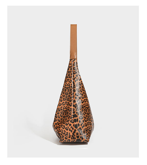 Glossy leopard-print slouchy shoulder bag with long strap and detachable tan zip pouch, detail view 12
