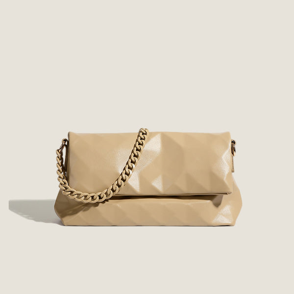 Cream white rectangular flap shoulder bag with geometric faceted surface and chunky tone-on-tone chain strap with gold-tone