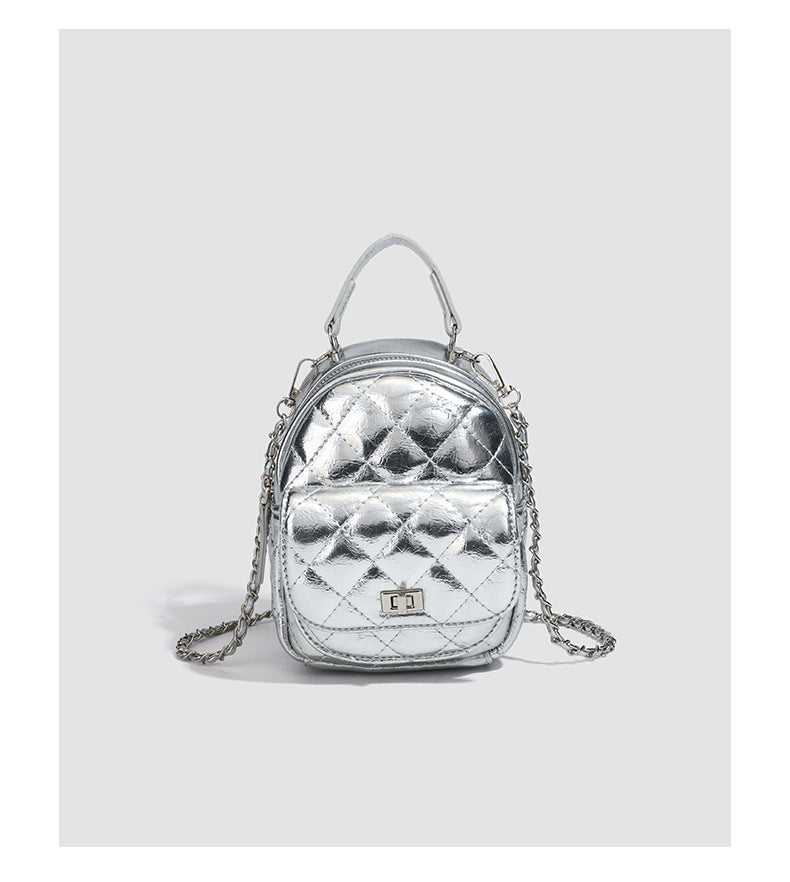 Quilted leather-look backpack purse with chain strap and turn-lock front pocket, detail view 17