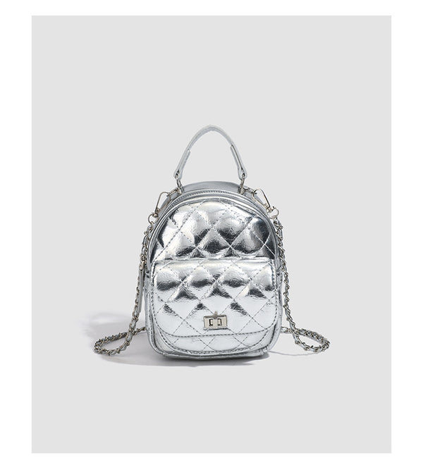 Quilted leather-look backpack purse with chain strap and turn-lock front pocket, detail view 17