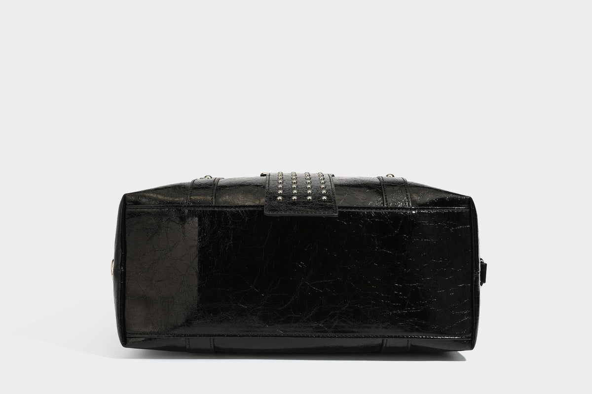 Glossy crinkled barrel handbag with silver stud buckle strap and detachable shoulder strap, detail view 36