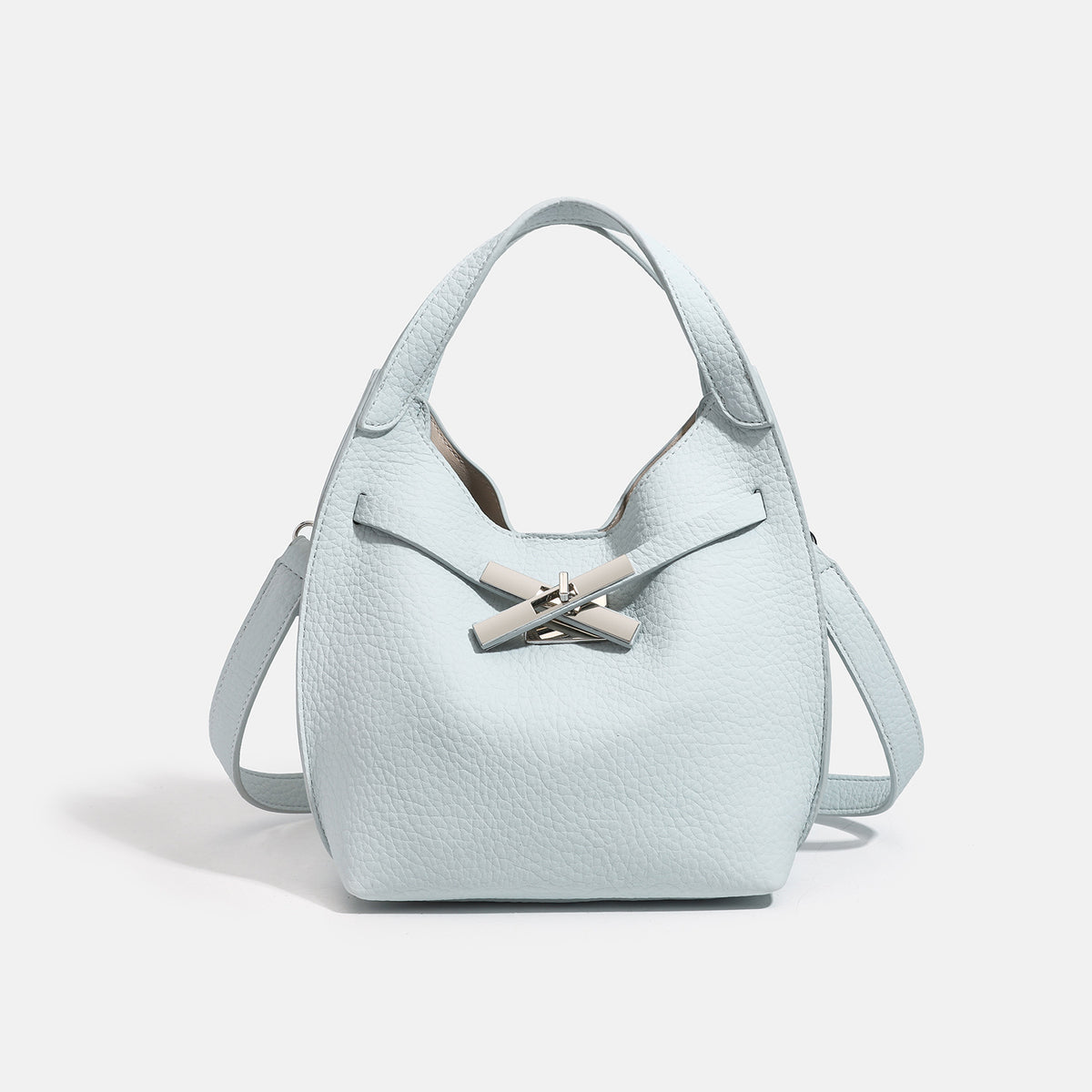 Compact pebbled leather-look shoulder bag with crossed silver-toned metal front closure, short top handle, and long, detail