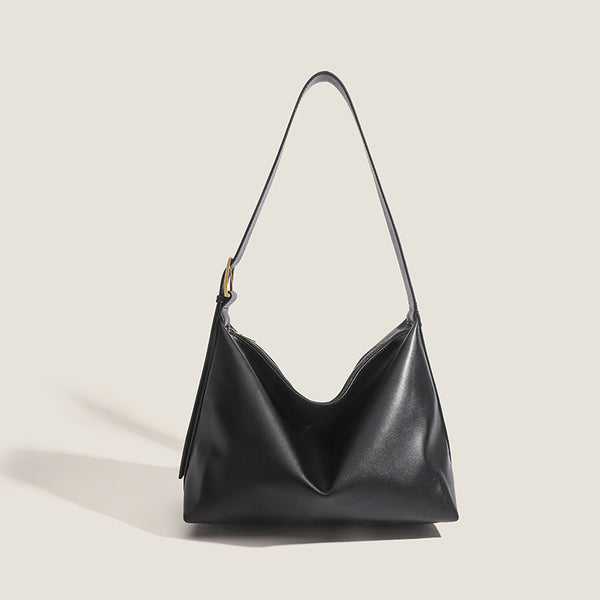 Large slouchy hobo shoulder bag in smooth leather-look finish with single long strap and gold-tone zip closure, detail view 9