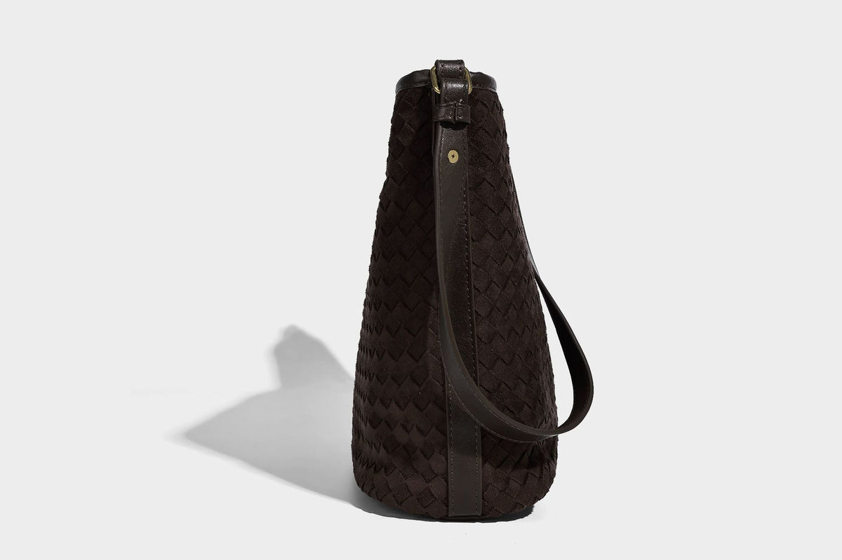 Dark chocolate woven texture hobo shoulder bag with multicolor tassel-and-bead charm and long adjustable strap, detail view