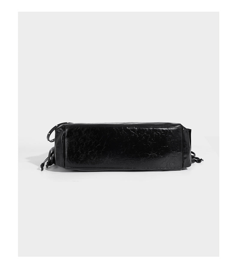 Glossy crinkled leather-look tote bag with silver grommet lace-up front detail, dual top handles, and detachable shoulder