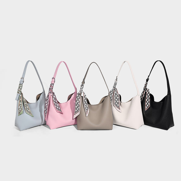 Soft slouchy hobo shoulder bag in pebbled matte finish with slim strap, silver-tone ring hardware, and knotted printed scarf