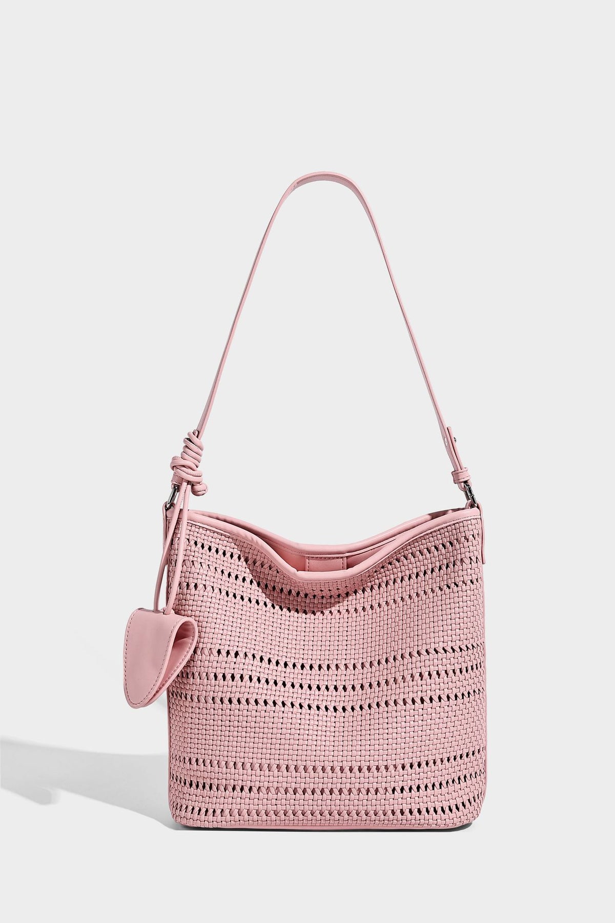 Handwoven open-weave shoulder bag with leather-look trim, knotted adjustable strap, and clip-on sunglasses sleeve pouch