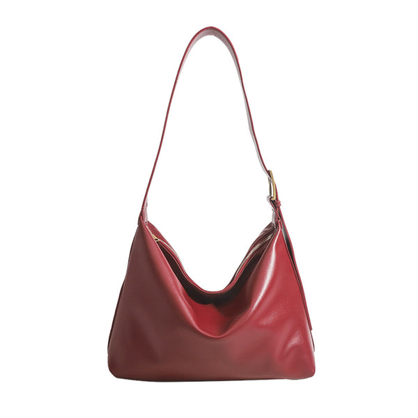 Large slouchy hobo shoulder bag in smooth leather-look finish with single long strap and gold-tone zip closure, detail view 5