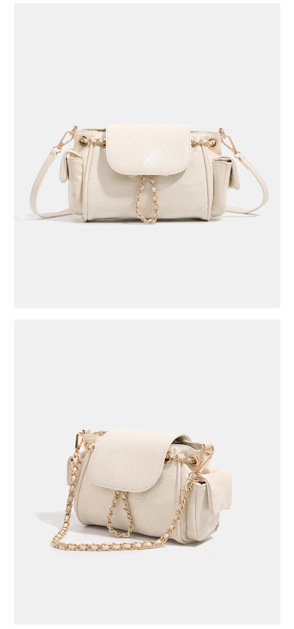 Small quilted leather-look flap bag with gold-tone chain strap and diamond stitch pattern, detail view 9