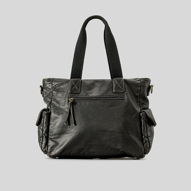 Slouchy crinkled pebbled leather-look convertible tote bag in gunmetal black with woven top handles, adjustable shoulder