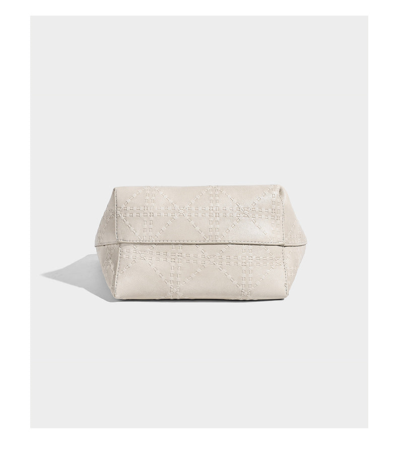 Quilted diamond-pattern tote bag with attached front zip pouch and long shoulder straps, detail view 11