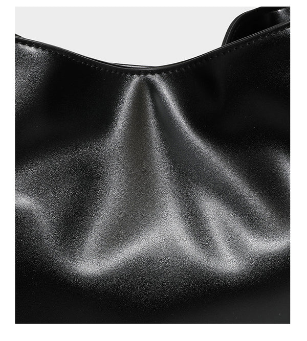 Structured glossy leather-look tote shoulder bag with dual top handles, detachable crossbody strap, side pockets, and, detail
