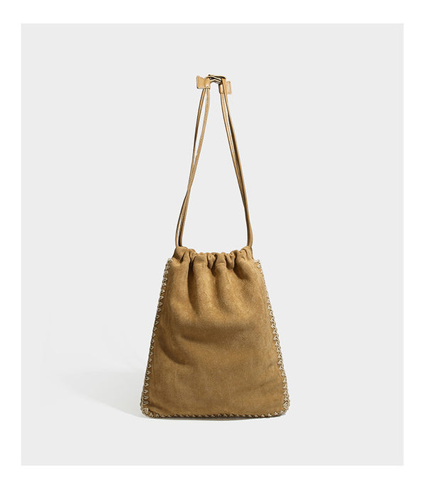 Matte suede-look drawstring bucket bag with cream braided woven edge trim and slim adjustable leather-look shoulder strap