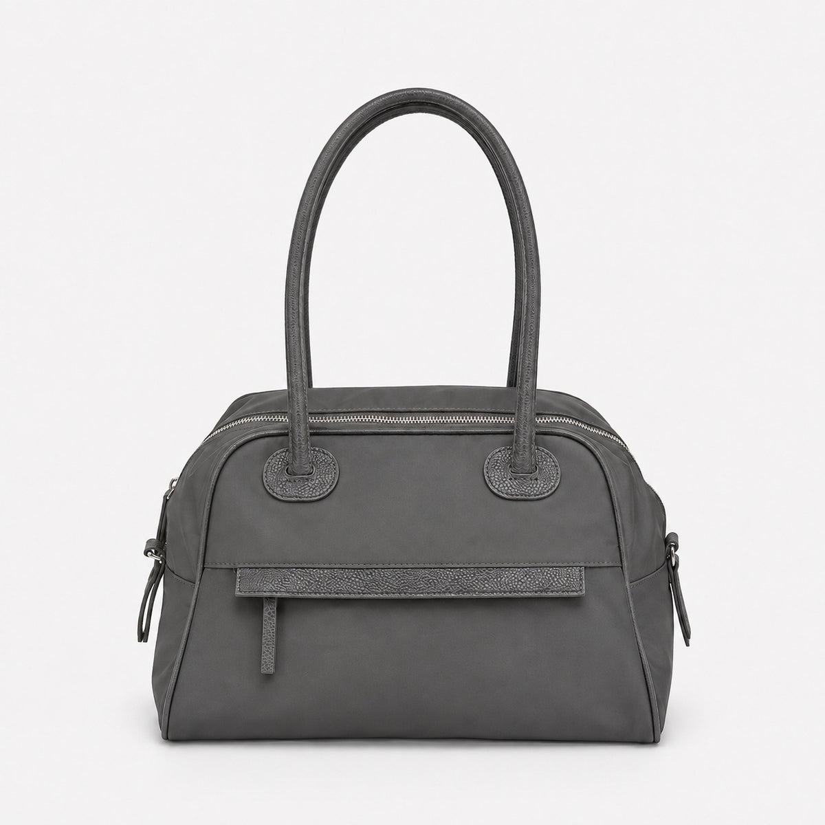Structured dome top-handle bag in matte nylon with pebbled vegan leather-look trim, zip-top closure, front slip pocket, and
