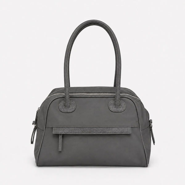 Structured dome top-handle bag in matte nylon with pebbled vegan leather-look trim, zip-top closure, front slip pocket, and