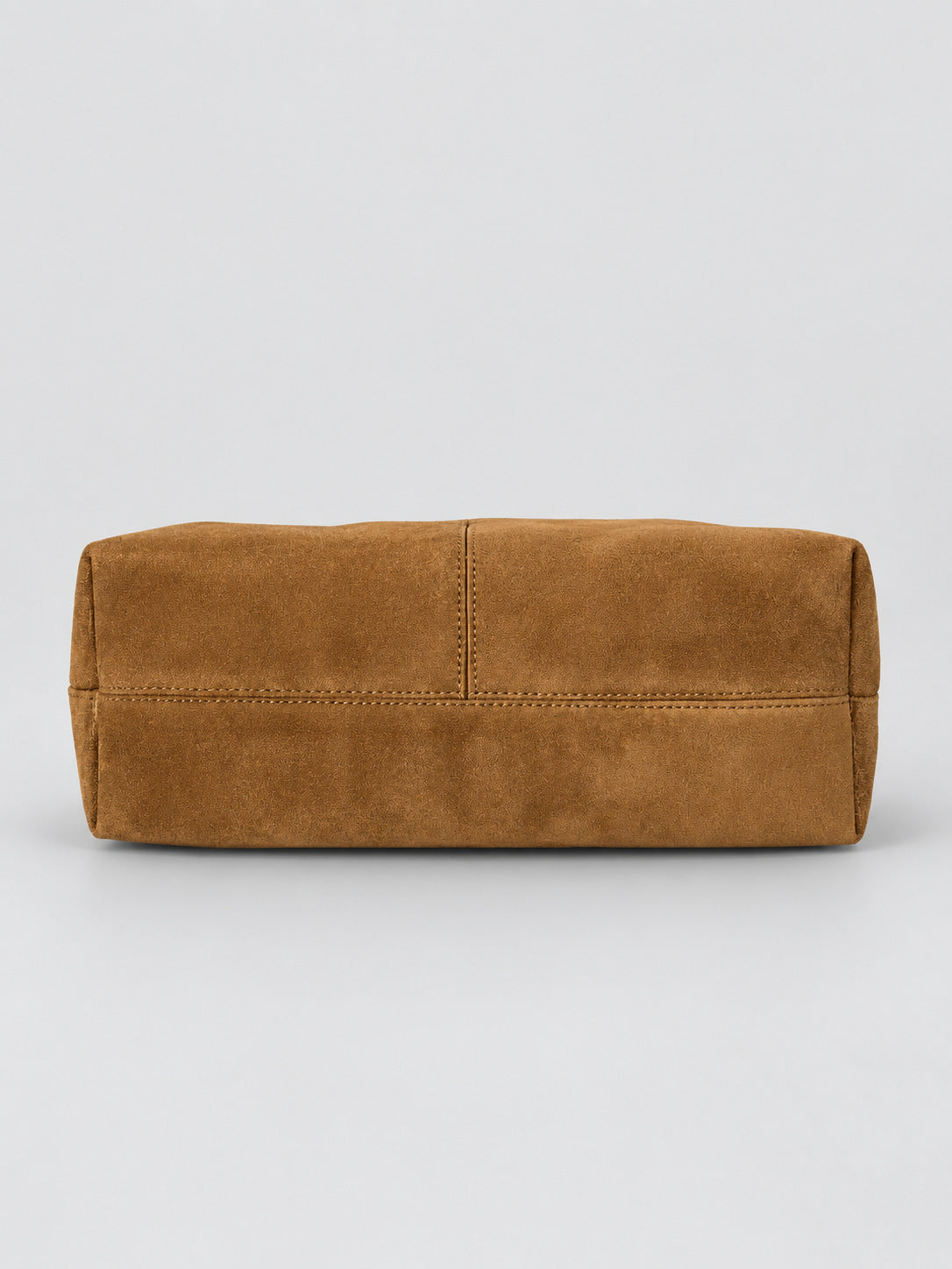Slouchy suede-look shoulder bag with gathered top, angular stitched paneling, and chunky gold-tone chain strap, detail view