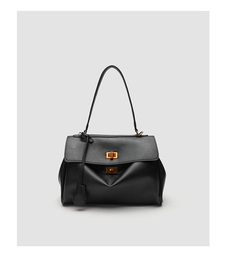 Structured black leather-look flap satchel bag with silver turn-lock hardware and top handle, detail view 23
