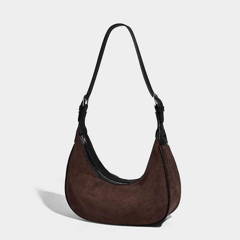 Crescent hobo shoulder bag in matte suede-look finish with black trim and adjustable strap, front view