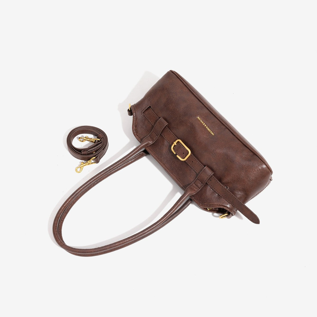 Strukturierte Baguette-Schultertasche mit vorderem Riemen mit Schnallendetail und zwei langen Henkeln, Detailansicht 3