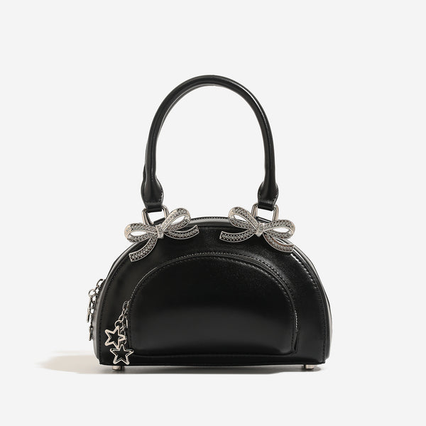 Structured half-moon mini handbag with silver-tone crystal bow hardware and star charm chain, detail view 4
