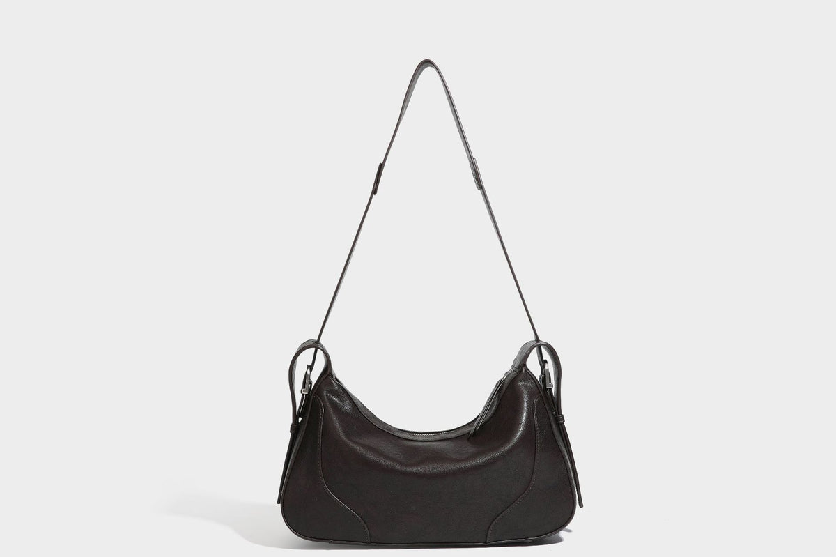 Slouchy crescent hobo shoulder bag in dark brown pebbled leather-look finish with zip top and long shoulder strap, detail