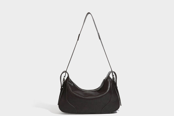 Slouchy crescent hobo shoulder bag in dark brown pebbled leather-look finish with zip top and long shoulder strap, detail