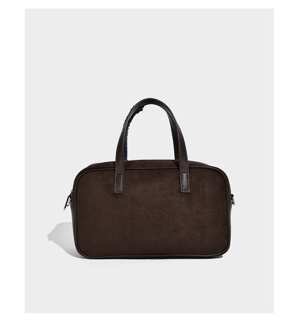 Strukturierte Boston-Henkeltasche in Dunkelbraun aus Material in Wildlederoptik mit Henkeln mit blauen Akzenten und abnehmbarem rundem Mini-Etui, Detailansicht