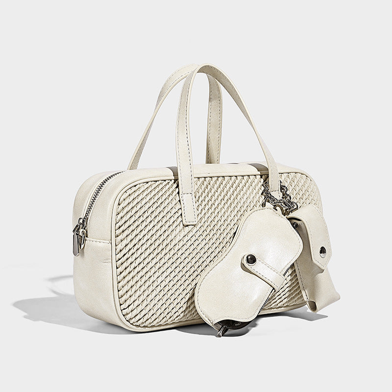 Structured woven-texture front top-handle handbag with zip closure, dual handles, detachable shoulder strap, and matching