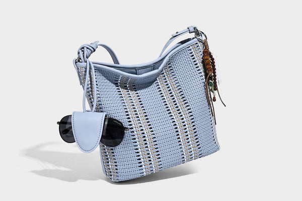 Woven bucket shoulder bag with leather-look trim, silver-tone hardware, and beaded tassel charm, detail view 42