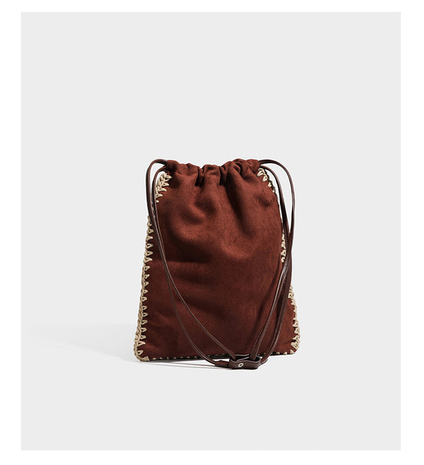 Matte suede-look drawstring bucket bag with cream braided woven edge trim and slim adjustable leather-look shoulder strap
