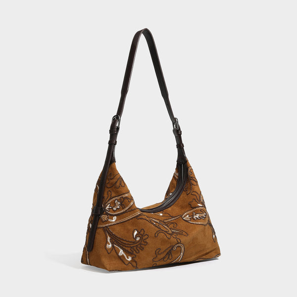 Deep chocolate suede-look hobo shoulder bag with tonal paisley floral embroidery, smooth dark leather-look trim, top zip
