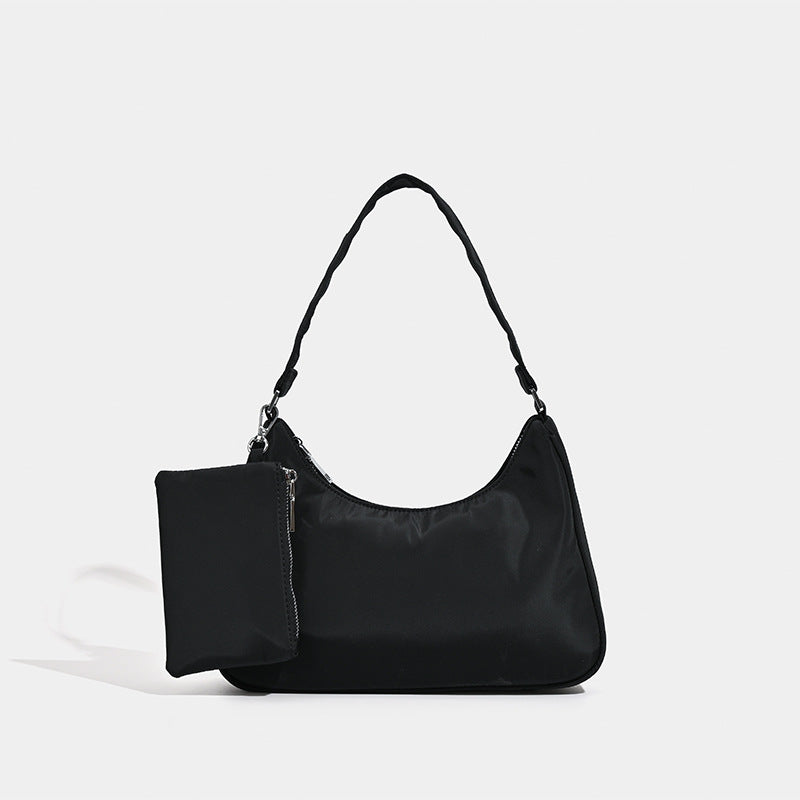 Curved hobo shoulder bag with detachable zip pouch in matte-satin finish with silver-tone hardware, detail view 6