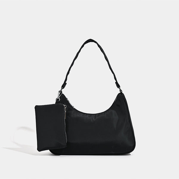 Curved hobo shoulder bag with detachable zip pouch in matte-satin finish with silver-tone hardware, detail view 6