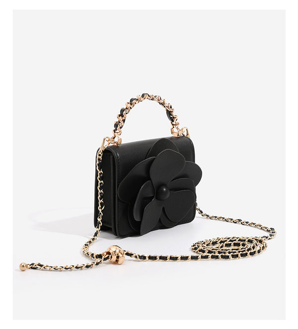 Small structured rectangular crossbody bag with layered 3D flower appliqué and gold-tone chain strap, detail view 13